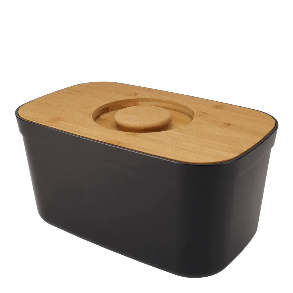 Leipälaatikko leikkuulaudalla Musta