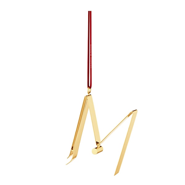 Ornament prydnadsbokstav M guld