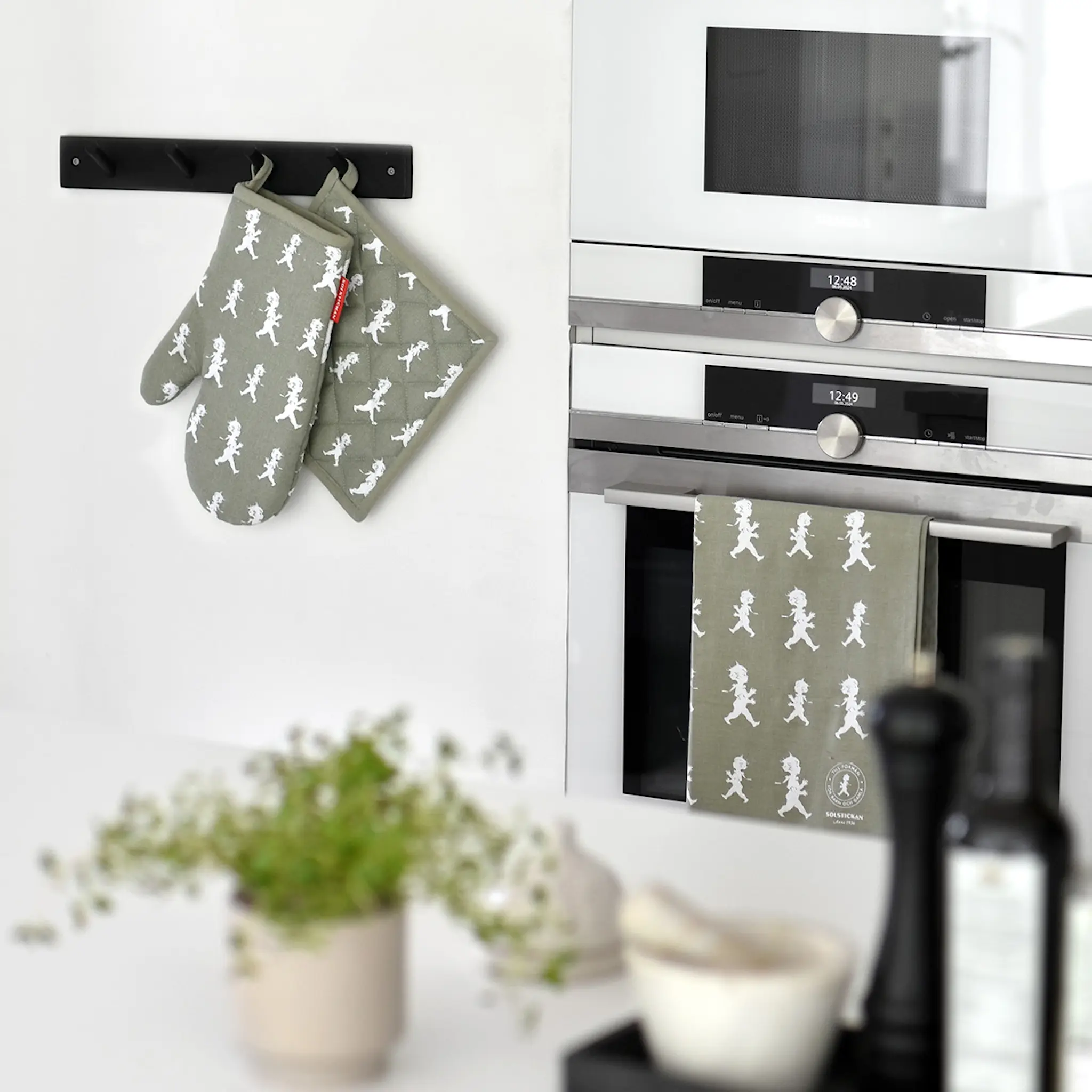 SOLSTICKAN Grytlapp 22 cm grön